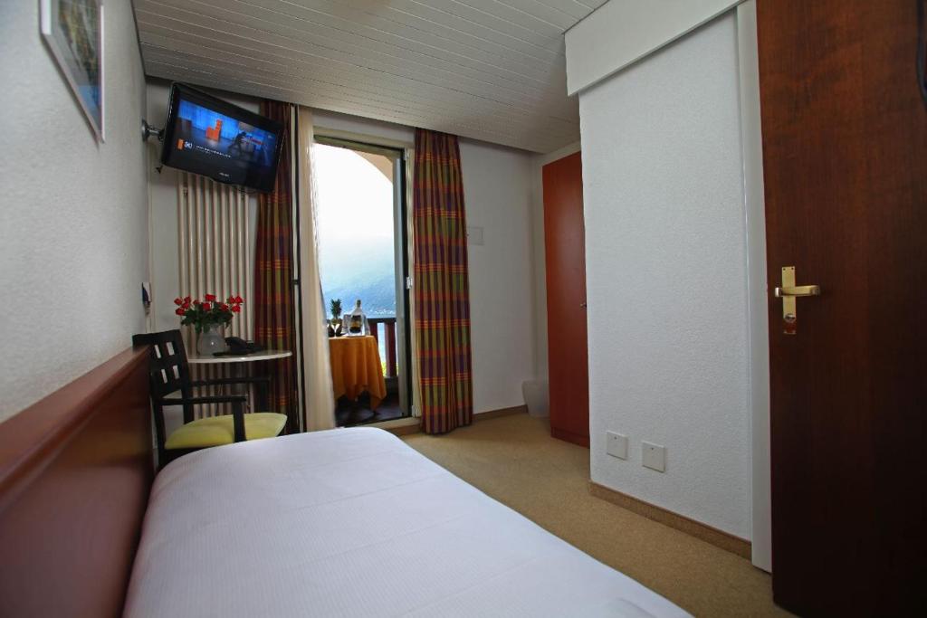 Postel nebo postele na pokoji v ubytování Piazza Ascona Hotel & Restaurants