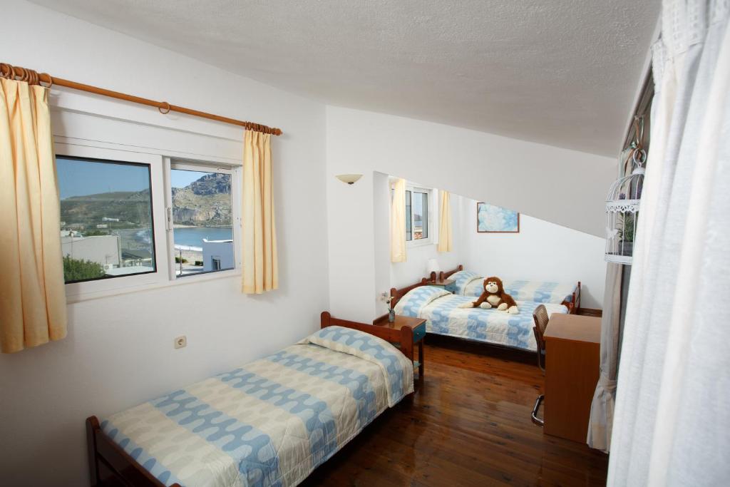 Posteľ alebo postele v izbe v ubytovaní Morpheas Apartments