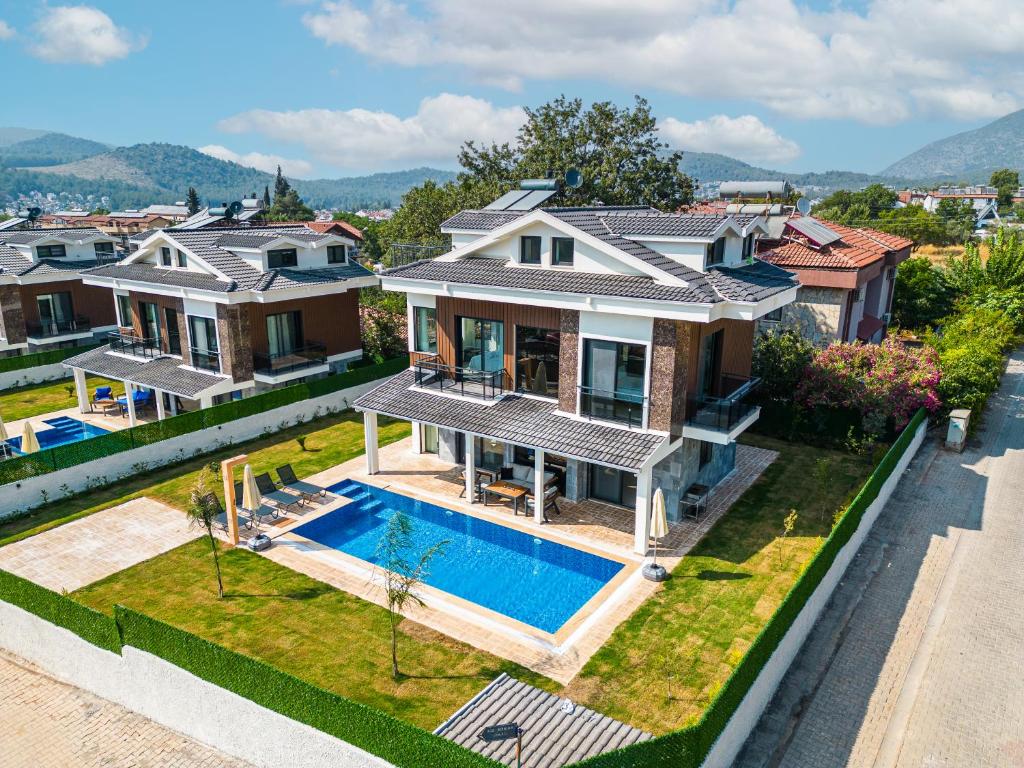 an aerial view of a house with a swimming pool at CAPELLA VİLLAS in Fethiye