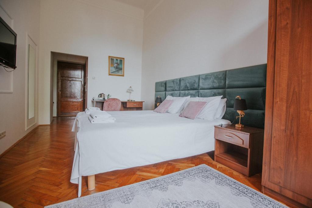 Postel nebo postele na pokoji v ubytování Dwór Zbożenna