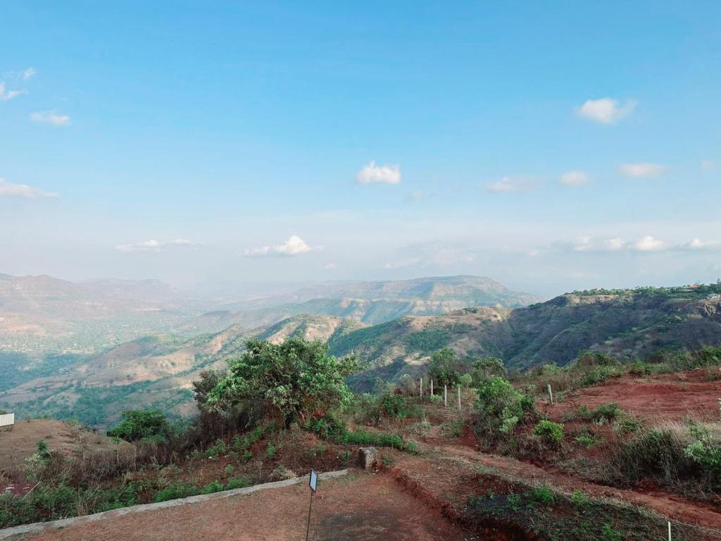 a view of the mountains from the top of a hill at VIDHI VILLA -Besides Valley View 360 with Luxurious Swimming pool & AC in Mahabaleshwar