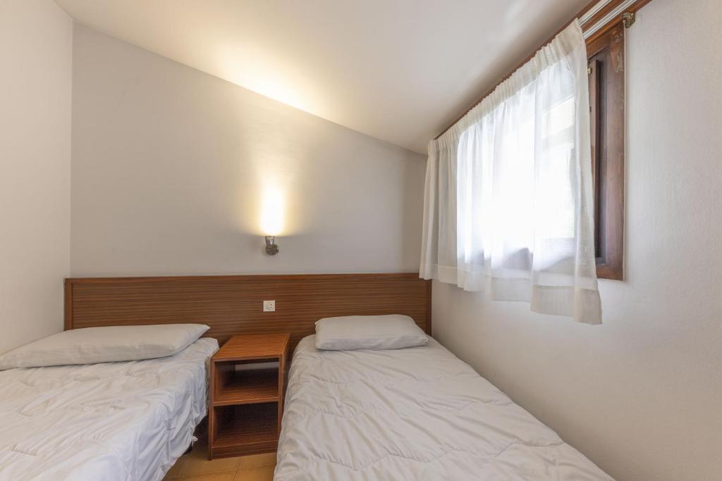 Postel nebo postele na pokoji v ubytování La Solana Apartaments & Spa