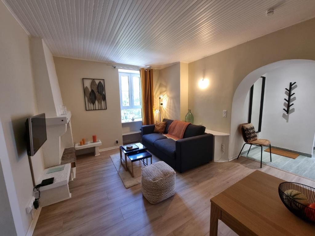 a living room with a couch and a table at Newly renovated 2 room apartment in Saint-Martin-Vésubie