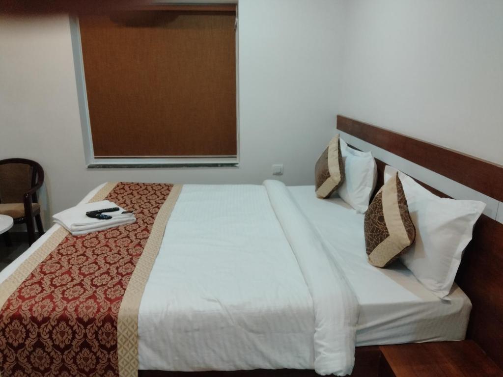 Postel nebo postele na pokoji v ubytování HOTEL SJ PREMIUM