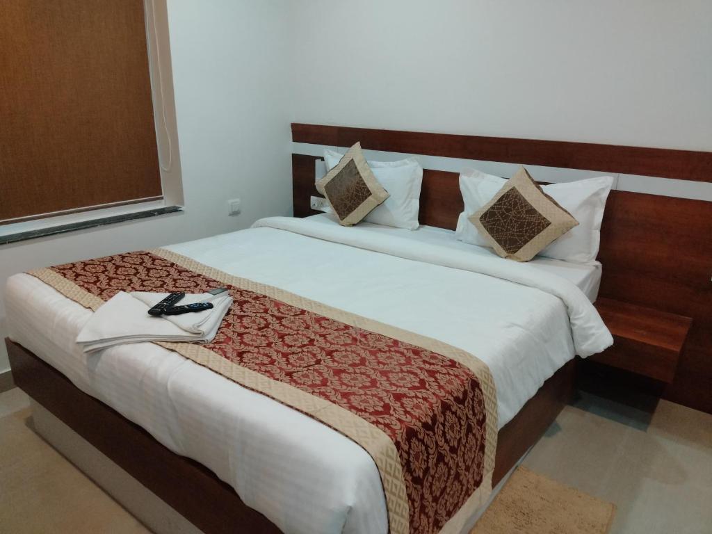 Postel nebo postele na pokoji v ubytování HOTEL SJ PREMIUM