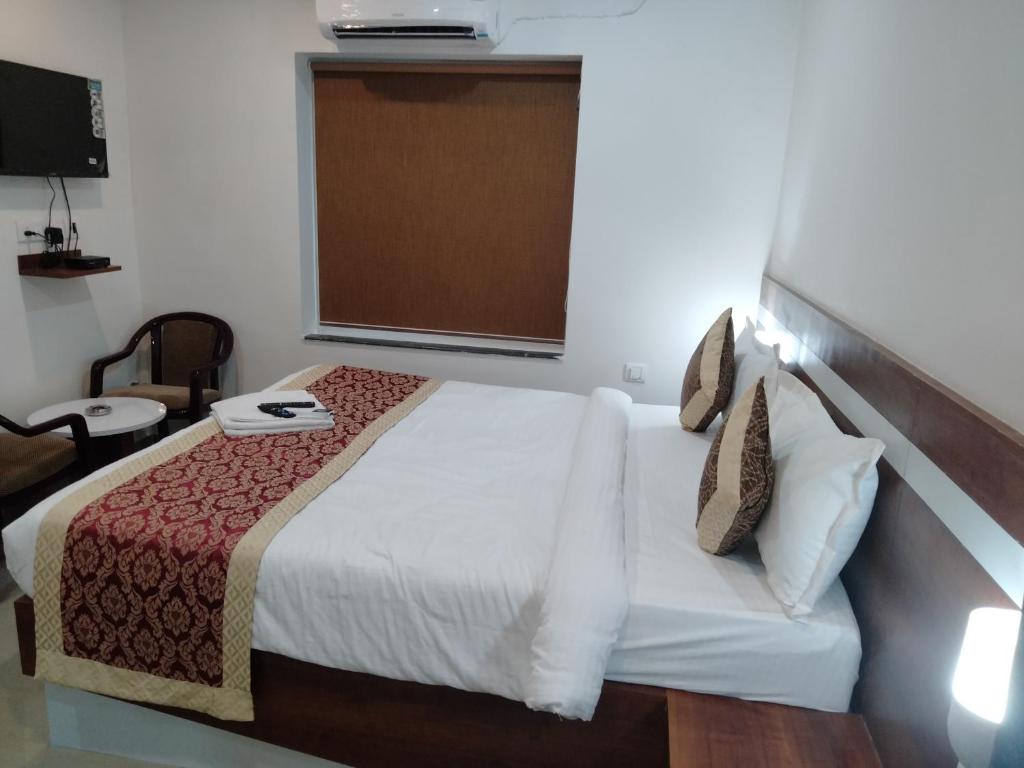 Postel nebo postele na pokoji v ubytování HOTEL SJ PREMIUM