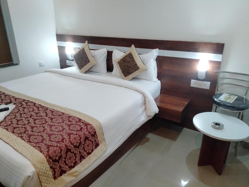 Postel nebo postele na pokoji v ubytování HOTEL SJ PREMIUM