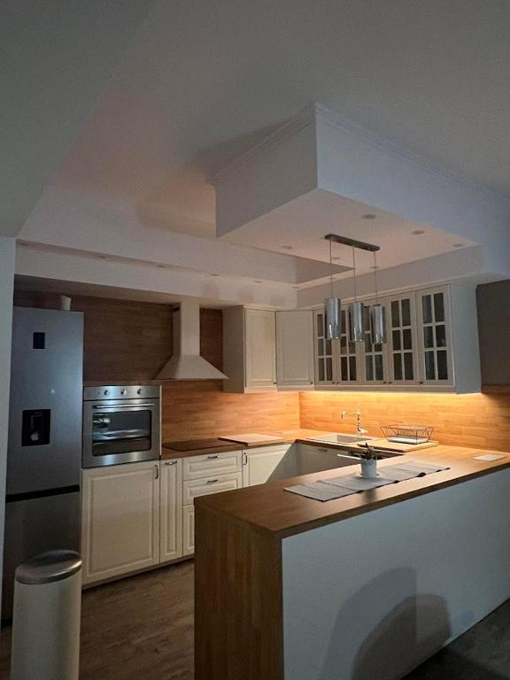 Kuchyň nebo kuchyňský kout v ubytování Exclusive apartment