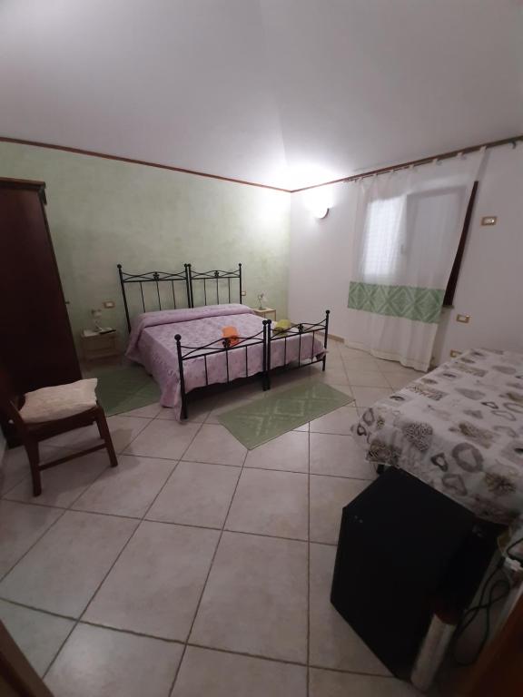 Postel nebo postele na pokoji v ubytování B&B Su Frascu Segau