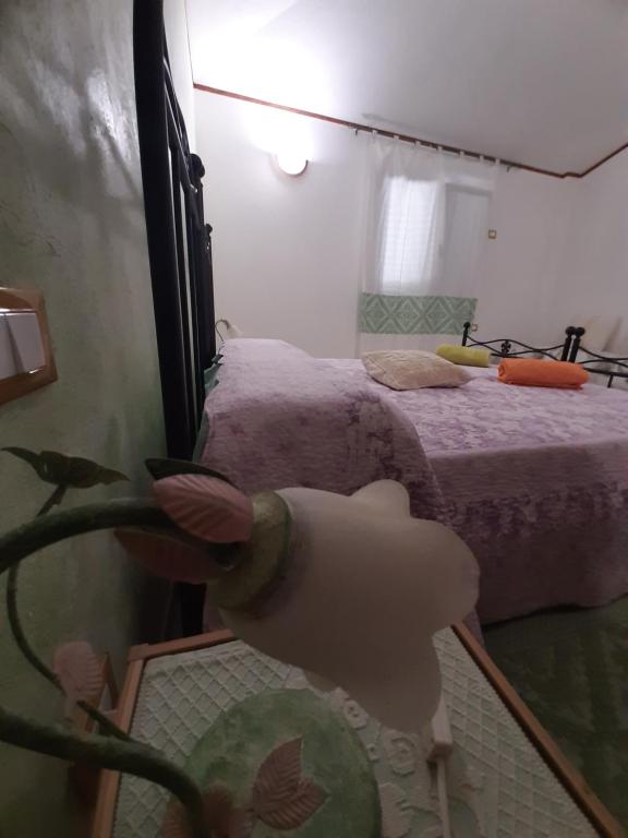 Postel nebo postele na pokoji v ubytování B&B Su Frascu Segau