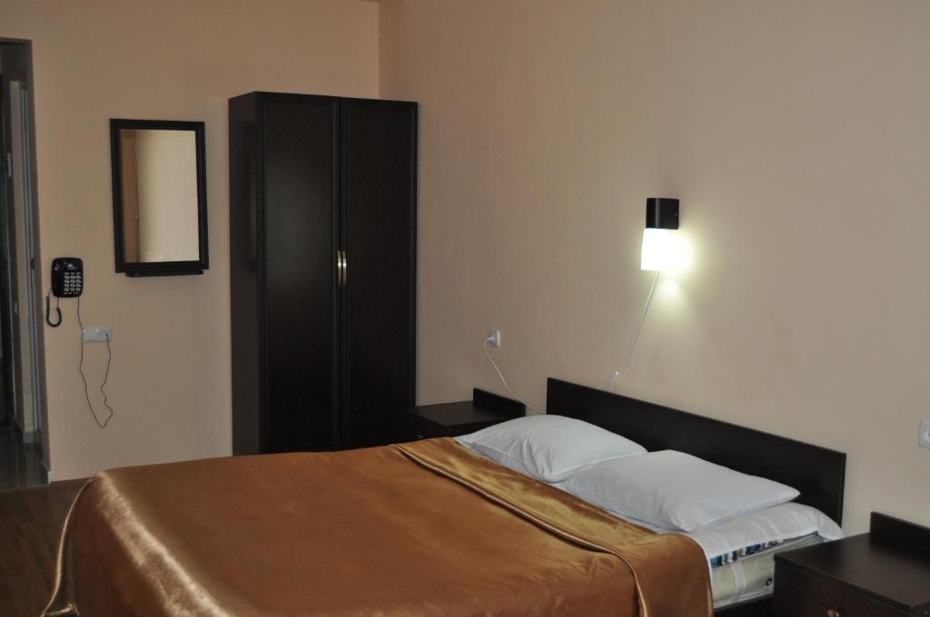 Postel nebo postele na pokoji v ubytování Hotel Solidarity