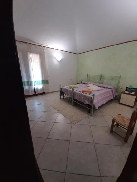 Postel nebo postele na pokoji v ubytování B&B Su Frascu Segau