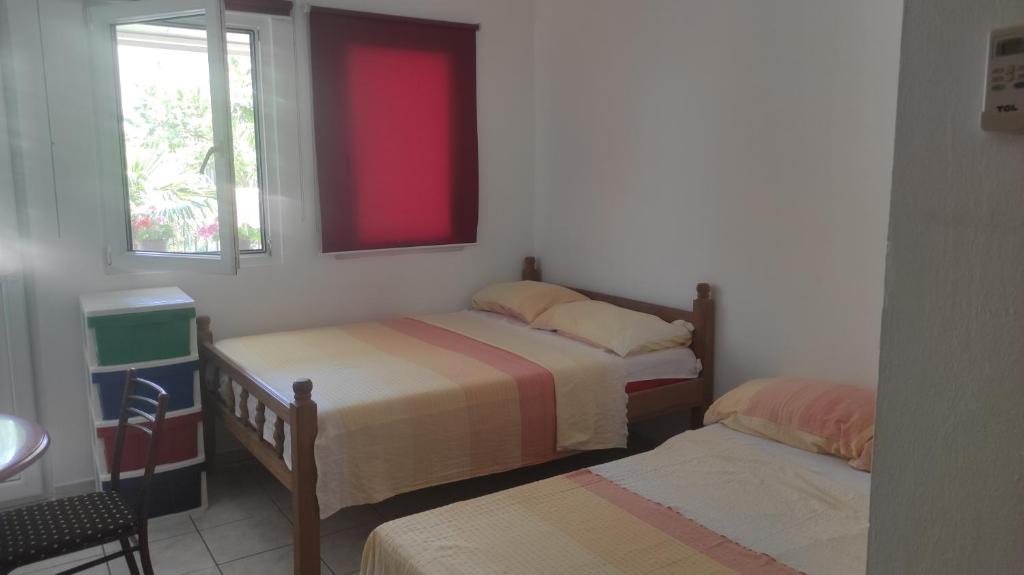 Postel nebo postele na pokoji v ubytování Maki Apartmani