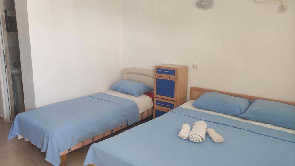 Postel nebo postele na pokoji v ubytování Maki Apartmani