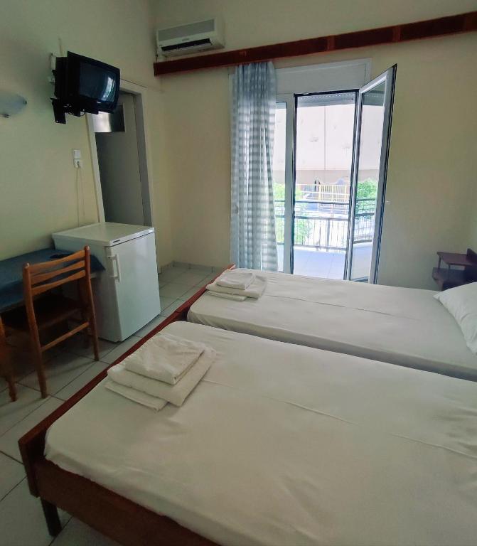 Postel nebo postele na pokoji v ubytování ΠΕΡΣΕΦΟΝΗ