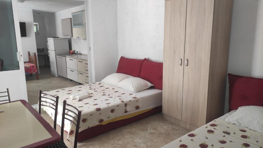 Postel nebo postele na pokoji v ubytování Maki Apartmani