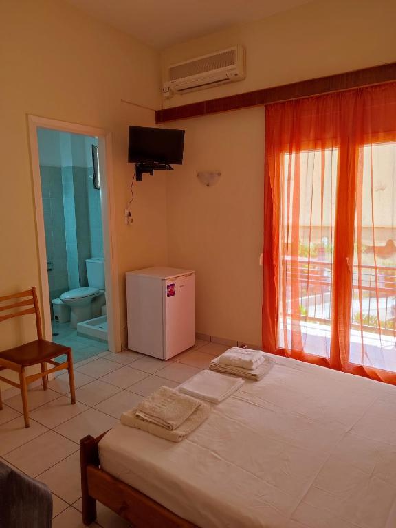 Postel nebo postele na pokoji v ubytování ΠΕΡΣΕΦΟΝΗ