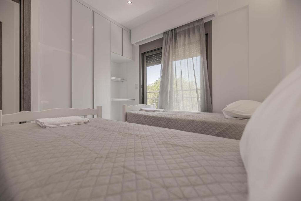 Postel nebo postele na pokoji v ubytování Diorisa House