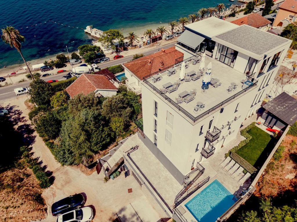 an overhead view of a house with a swimming pool at SkyView apartments in Herceg-Novi