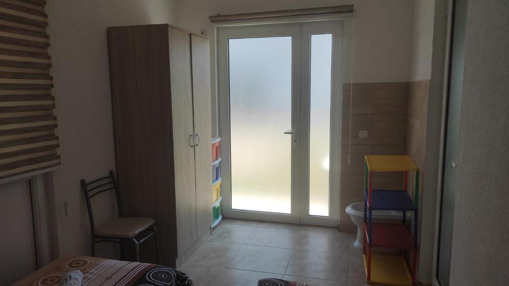 Postel nebo postele na pokoji v ubytování Maki Apartmani