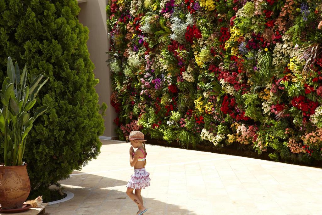 A garden outside Pomegranate Wellness Spa Hotel