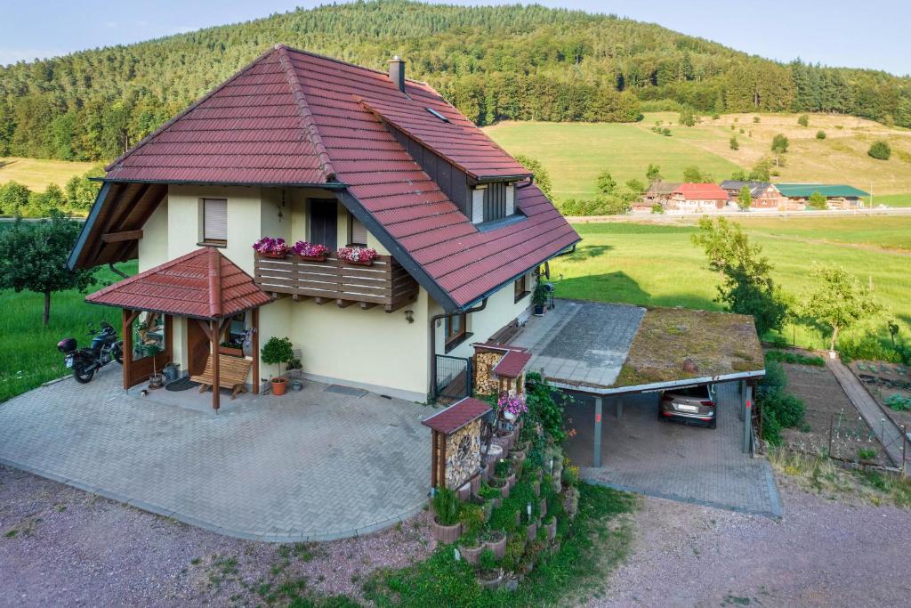 an aerial view of a house with a red roof at Ferienwohnung Ohnemus in Schuttertal
