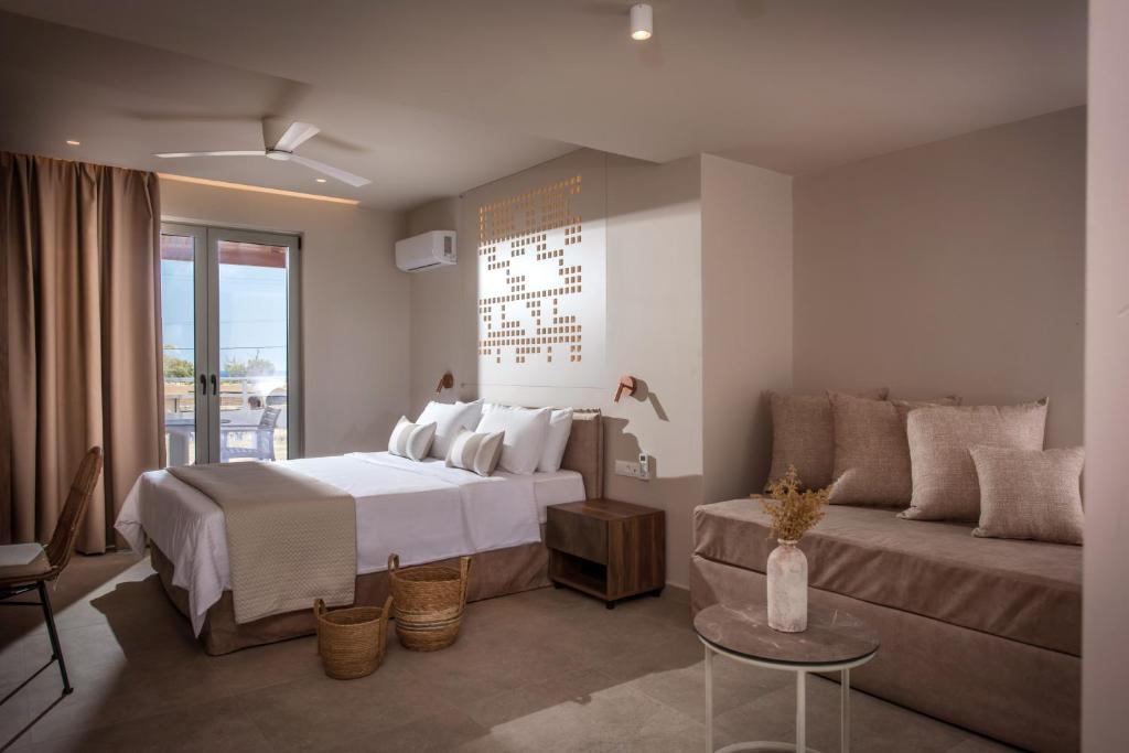 Postel nebo postele na pokoji v ubytování Ariadni Apartments