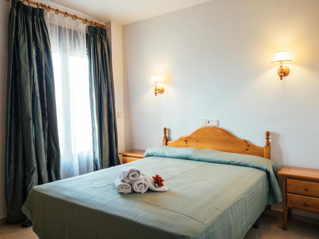 Ένα ή περισσότερα κρεβάτια σε δωμάτιο στο HOTEL VALMAR