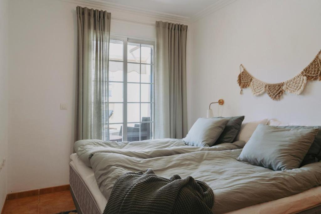 Łóżko lub łóżka w pokoju w obiekcie AP378 Casa Maria