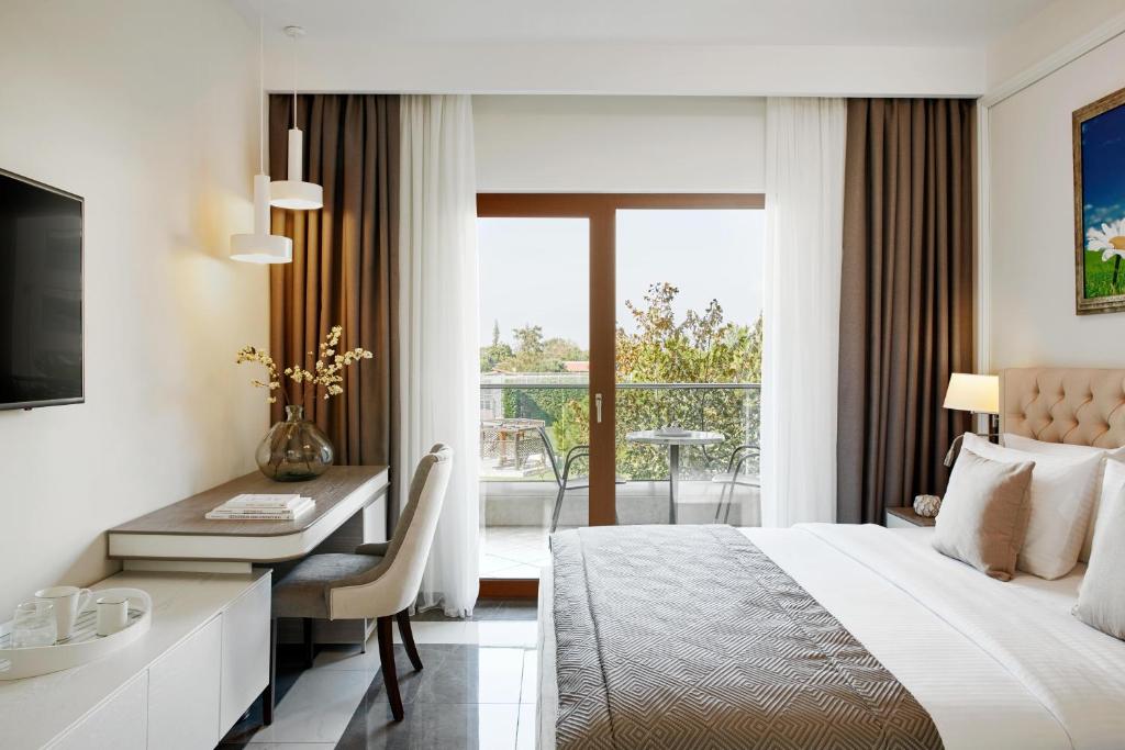 A bed or beds in a room at Potidea Palace Hotel