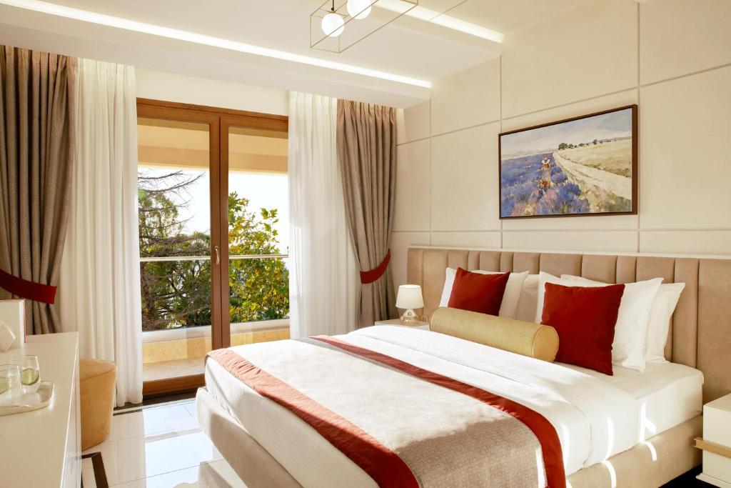 A bed or beds in a room at Potidea Palace Hotel