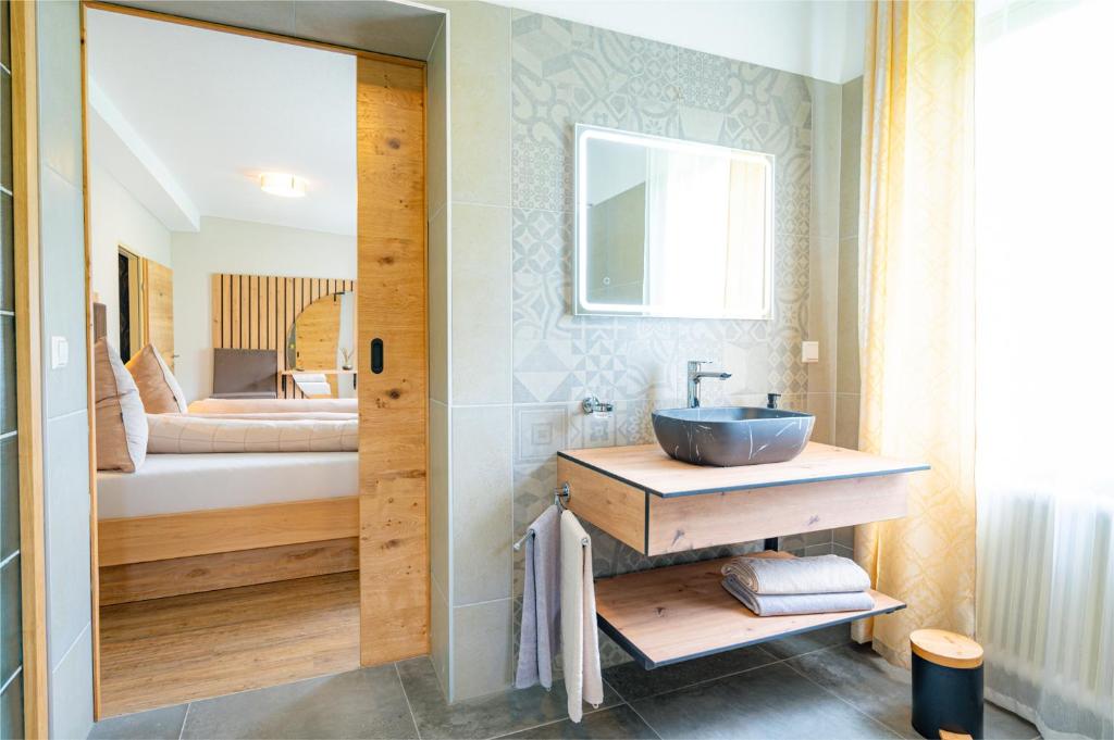 Postel nebo postele na pokoji v ubytování Lorettohof Hotel Garni