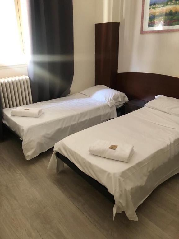Postel nebo postele na pokoji v ubytování Hotel Galla