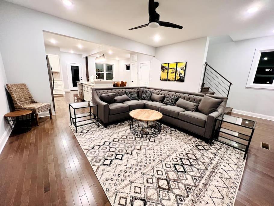 a living room with a couch and a table at Riverside House in Asheville