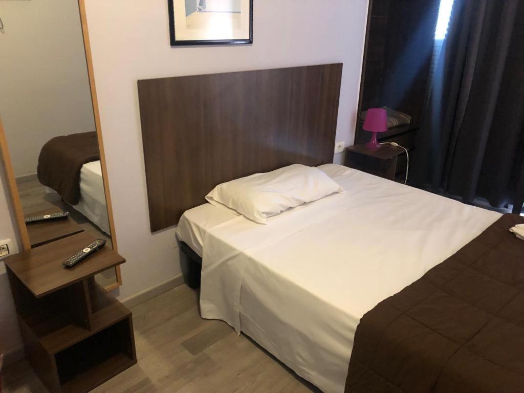 Postel nebo postele na pokoji v ubytování Hotel Galla
