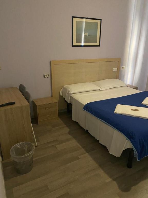 Postel nebo postele na pokoji v ubytování Hotel Galla