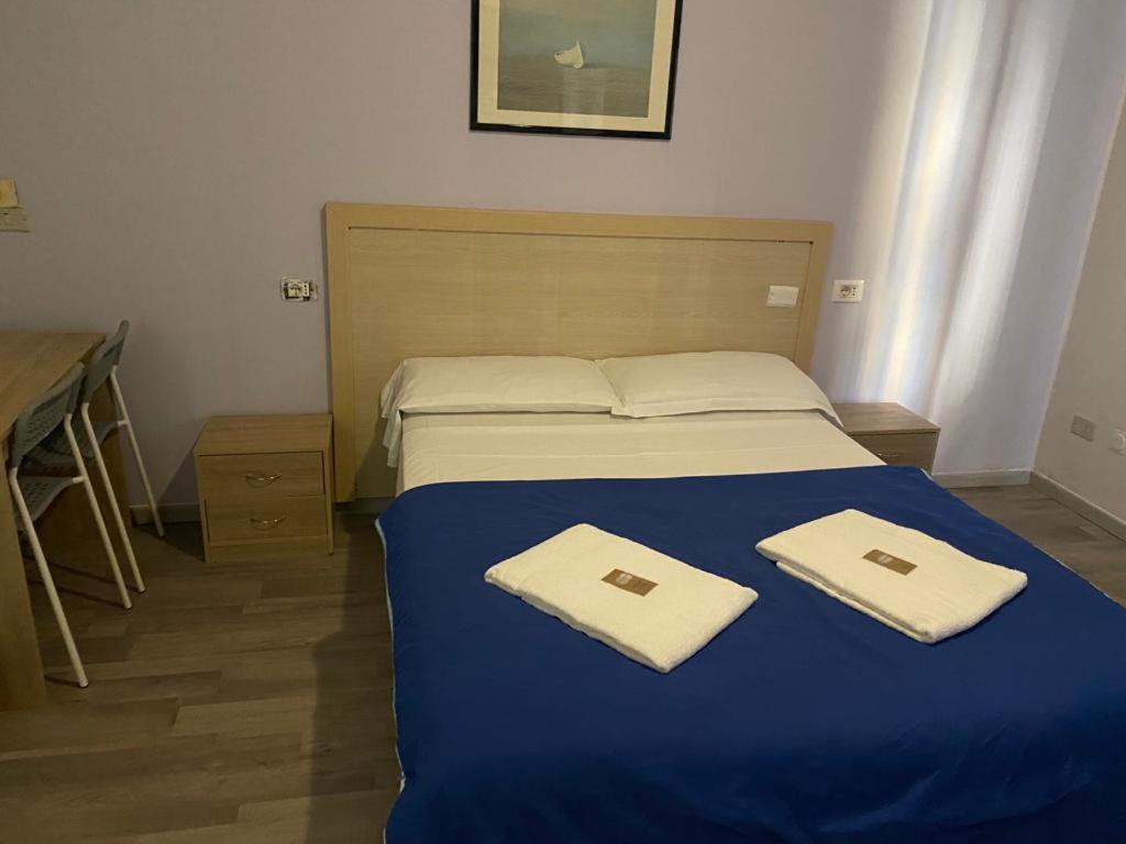 Postel nebo postele na pokoji v ubytování Hotel Galla