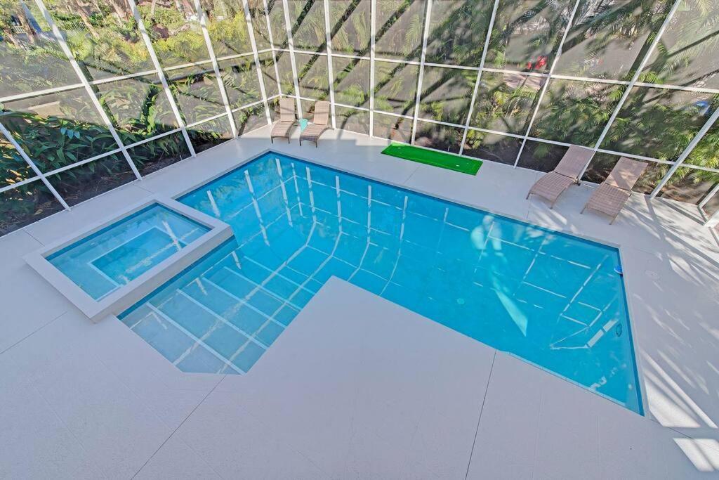 an overhead view of a swimming pool in a house at Family friendly with large pool in Sarasota