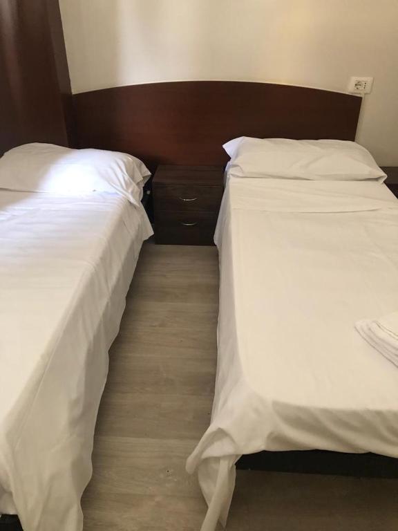 Postel nebo postele na pokoji v ubytování Hotel Galla