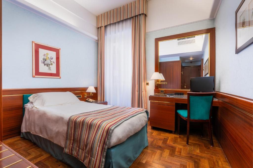 Postel nebo postele na pokoji v ubytování Hotel Crivi's