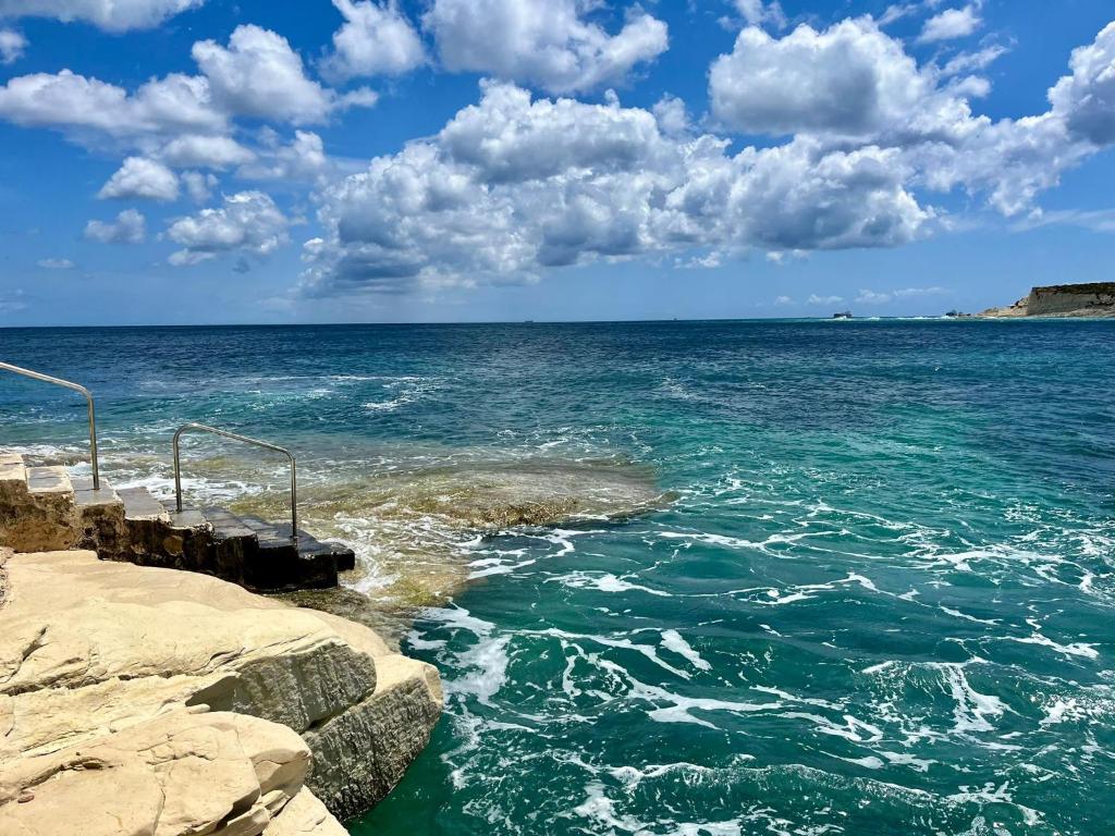 a view of the ocean from a pier at Peaman Court in Marsaskala