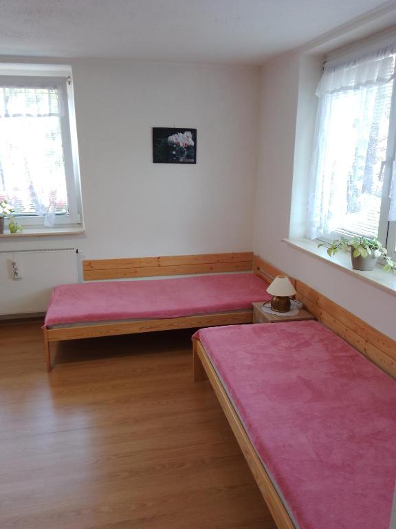 Postel nebo postele na pokoji v ubytování apartman.lara