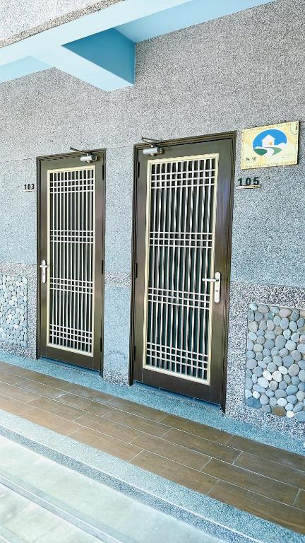 two doors on the side of a building at Sun B&amp;B in Taitung City