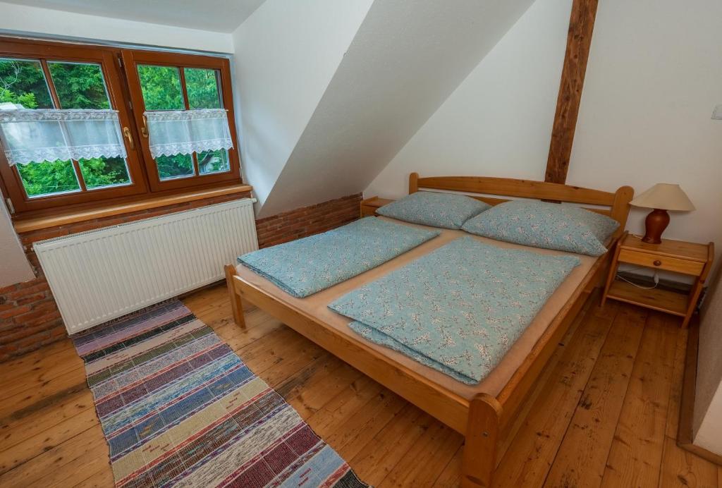 Postel nebo postele na pokoji v ubytování Penzion pod Pralesem