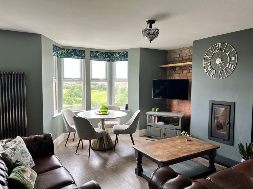 a living room with a couch and a table at River View in Keynsham