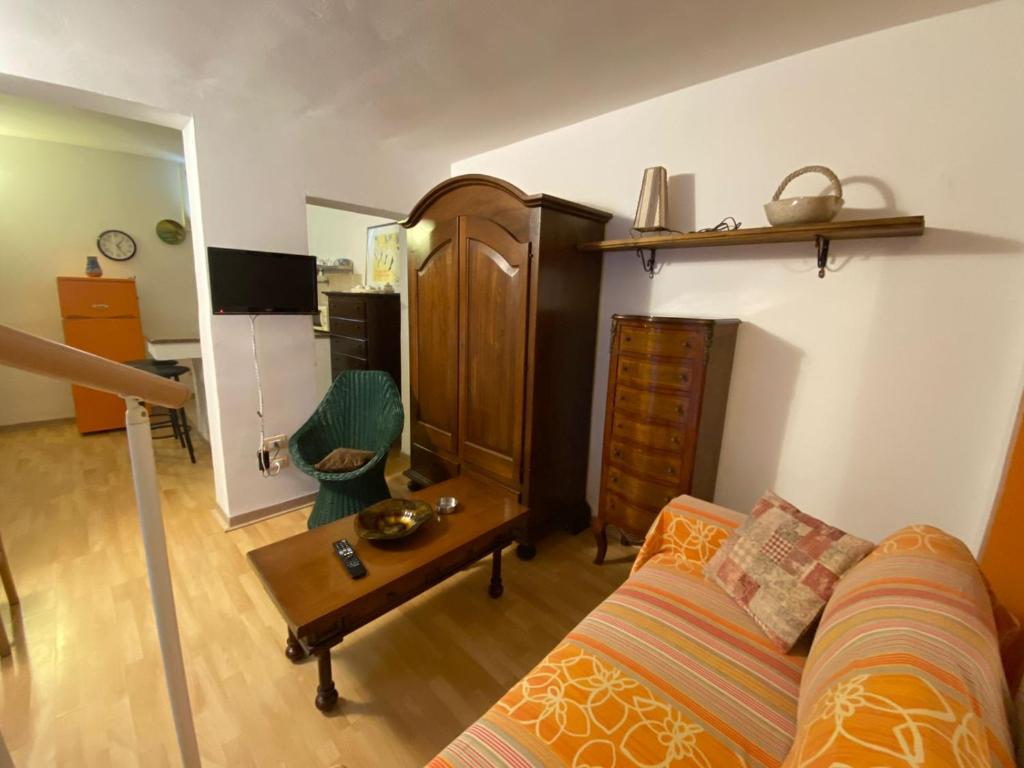 a living room with a couch and a table at Casa Vacanze lecce Luppiu in Lecce