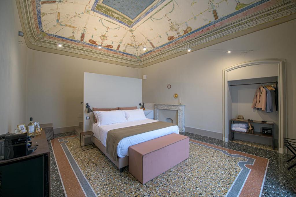 Posteľ alebo postele v izbe v ubytovaní Palazzo Sertorio Suites
