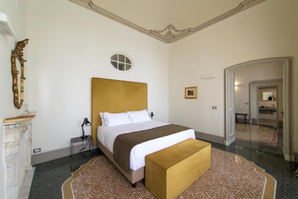Posteľ alebo postele v izbe v ubytovaní Palazzo Sertorio Suites
