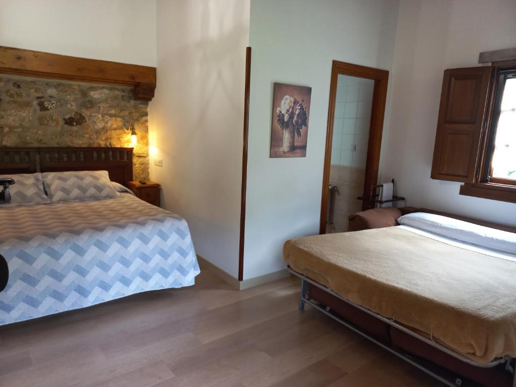 Postel nebo postele na pokoji v ubytování Posada Gema