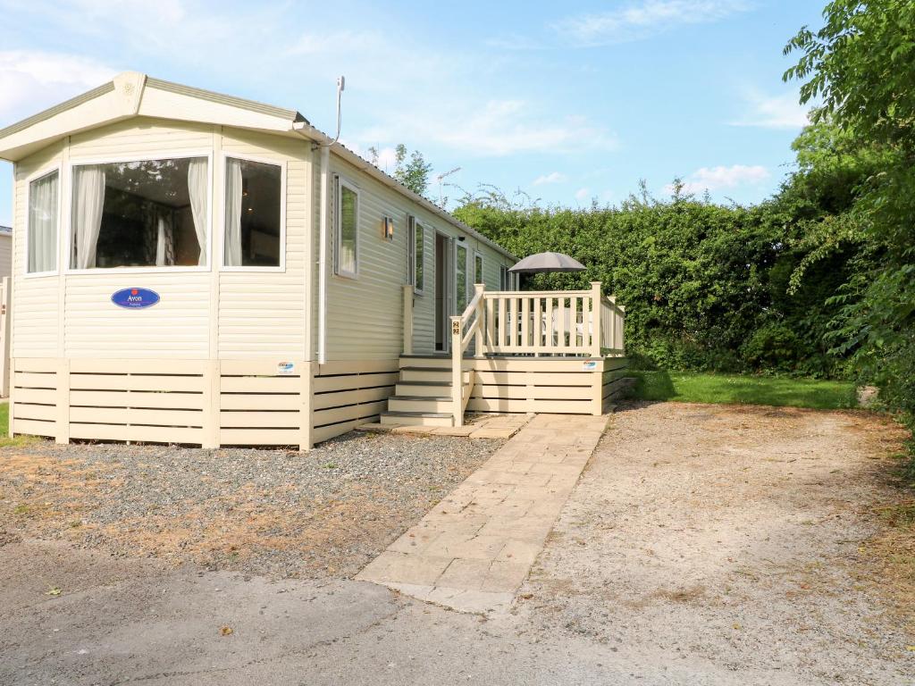 a mobile home with a porch and a deck at 22 Washbrook Way - Ashbourne Heights in Ashbourne